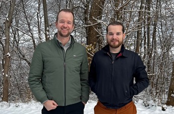 two people staning in snow