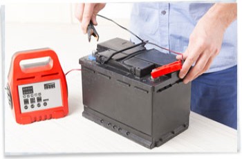 A leisure battery being connected to a battery charger